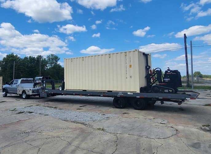 Mule unloading shipping container